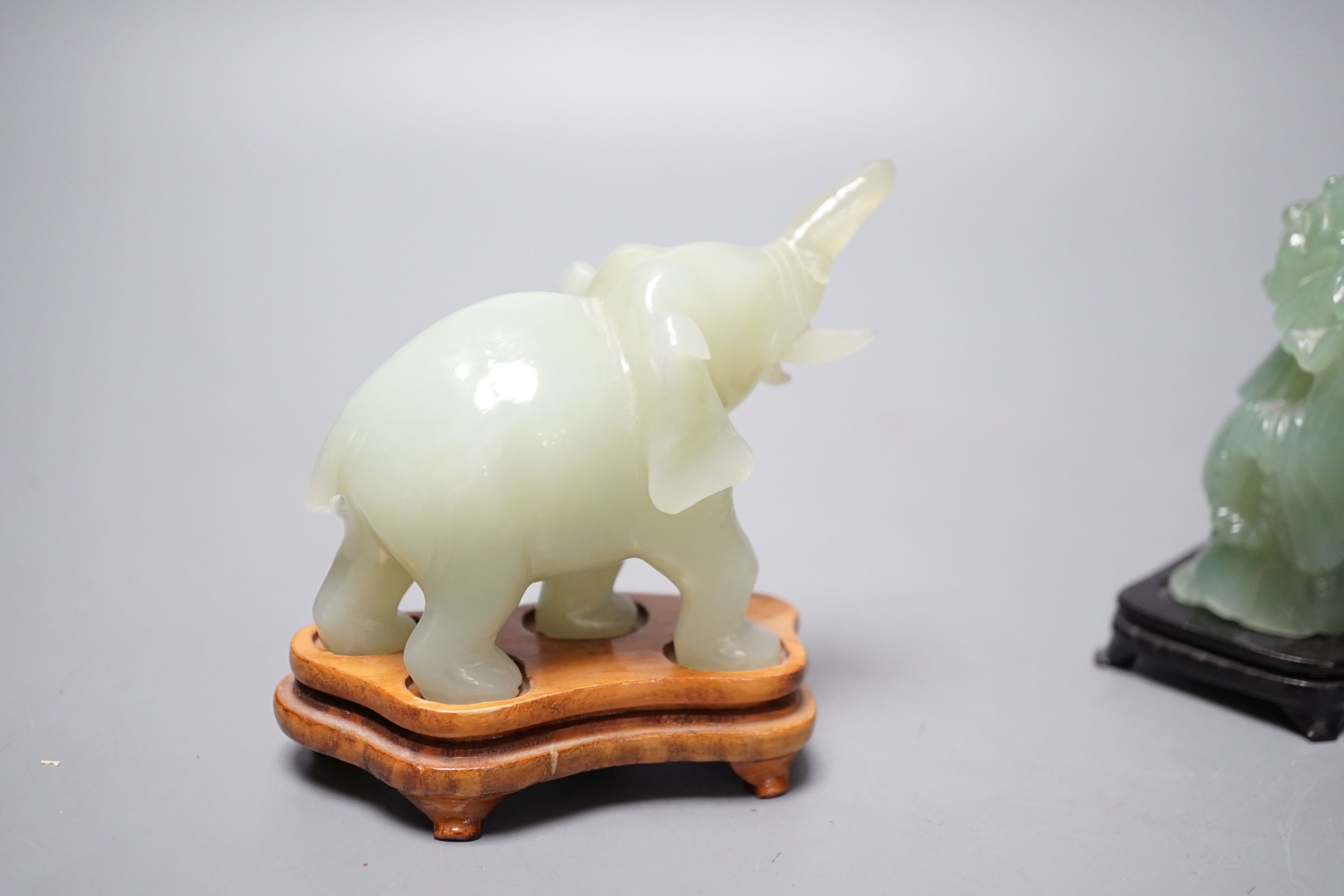 Two bowenite carvings of an elephant and Budai, wood stands, tallest, 9.5cm